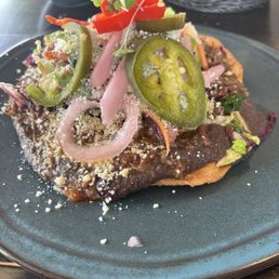 Barrios Fine Mexican Dishes signature dishes Beef Skirt AdoboTraditional Smashed GuacamoleRoasted Chicken Enchiladas